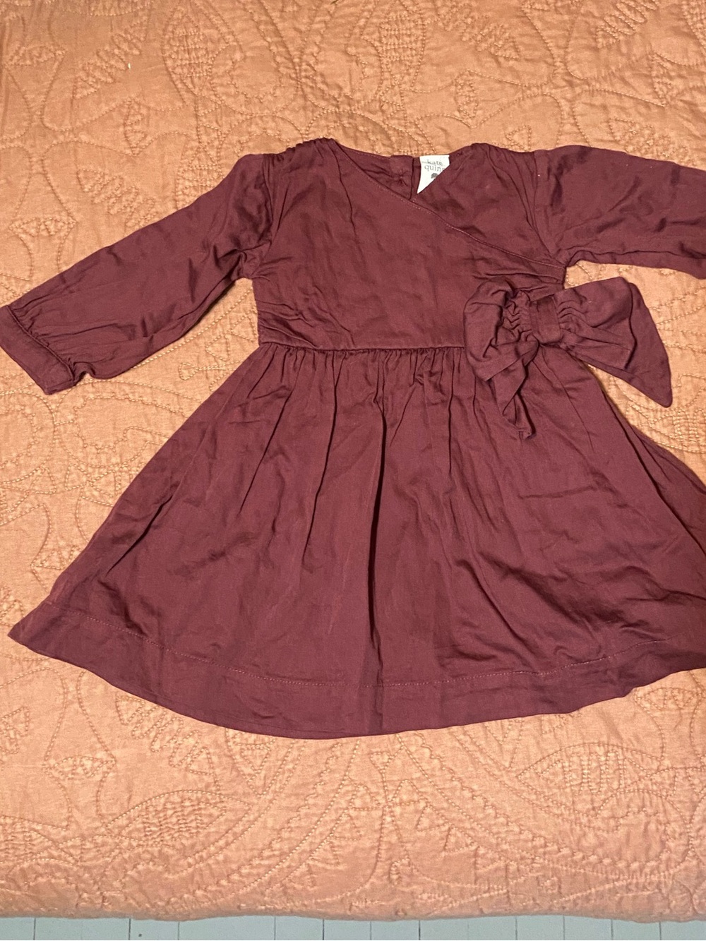 Kate Quinn mauve bow dress